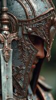 Detailed close-up of ornate armor and helmet highlighting craftsmanship in a fantasy setting during twilight photo