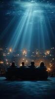 Viewers enjoy a captivating performance in an underwater venue with dramatic lighting effects during a night event photo