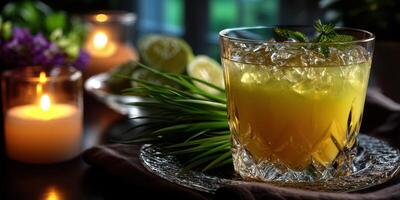 Refreshing cocktail served with fresh limes and herbs in a cozy setting during the evening hours photo