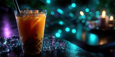 Refreshing iced beverage with tapioca pearls in a cozy setting during the evening photo