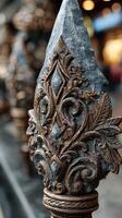 Ornate metalwork detail showcasing craftsmanship in an urban setting during daylight photo