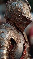 Knight in ornate armor stands proudly during a medieval festival in the heart of the city at dusk photo