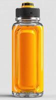 Bright orange beverage in a sleek glass bottle with a metal cap displayed on a neutral background photo