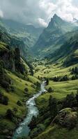 Stunning mountain valley with a winding river and lush greenery under cloudy skies in the early morning photo