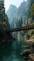 Wooden bridge spans serene river surrounded by autumn colors in mountainous landscape during early morning hours photo