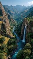 Majestic waterfall cascades through rugged mountains in a serene valley during midday photo