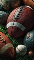 Various sports balls displayed on green grass capturing the essence of outdoor games and teamwork during a sunny day photo