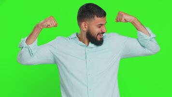 Man looking confident showing biceps feeling power strength to fight for rights, success win video