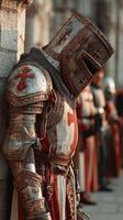 Historic knight in ornate armor stands guard during a medieval reenactment at a castle in the late afternoon sun photo