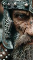 Detailed close-up of a medieval warrior showing determination and grit during a battle re-enactment photo