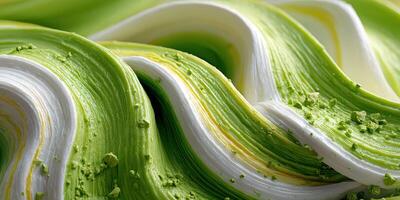 Swirling green and white mixture showcasing craftsmanship in dessert preparation at a culinary event photo