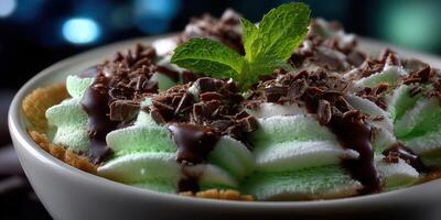 Delicious dessert featuring mint, chocolate, and whipped cream in a cozy setting at night photo