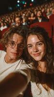 Couple enjoys a theater performance during a lively evening show in a packed venue filled with excitement and anticipation photo