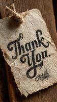 Handwritten thank you note on rustic wood background creates a warm, heartfelt atmosphere for expressing gratitude photo