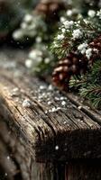 Winter nature setting showcasing wooden surface with pine branches and pine cones adorned with fresh snowflakes photo