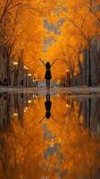 Girl embraces autumn colors in a charming alley filled with golden trees and reflections photo