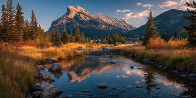 Breathtaking mountain landscape with a serene river at sunset in a Canadian national park photo