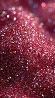 Sparkling red glitter shimmers brightly under soft light creating a mesmerizing effect in a close-up view photo