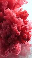 Vibrant red smoke fills the air, creating a dramatic and artistic display for creative backgrounds or visual effects photo