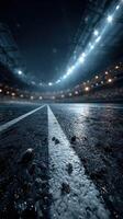 Stadium track illuminated by bright lights with wet surface during an evening event in a bustling sports arena photo