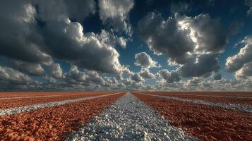 Striking view of a long path under a dramatic sky filled with clouds during the day photo