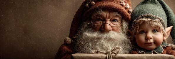 Santa and an elf hold a gift in a cozy, festive setting during the holidays at a workshop photo