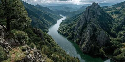 Stunning view of a winding river surrounded by lush hills and dramatic cliffs photo