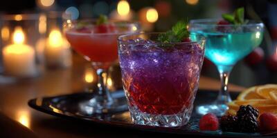 Colorful cocktails served in elegant glasses at a lively evening gathering with soft candlelight photo