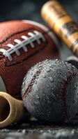 Various sports balls and equipment arranged with droplets of water in a damp setting focused on athletic activities photo