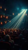 Audience captivated by a breathtaking performance in a dimly lit theater during a night show photo
