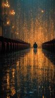 Man sitting alone in an elegant theater with golden lights reflecting on the wet floor at night photo