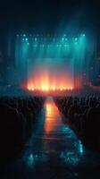 Bright stage lights illuminate an empty theater filled with eager audience members before a performance begins photo
