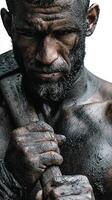 Portrait of a strong man with a battle axe, showcasing determination and strength in a dramatic black and white setting photo