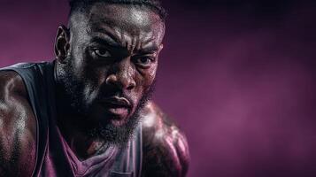 Intense athlete focused during training session in dramatic lighting at gym photo
