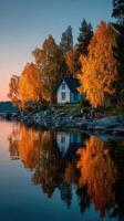 Charming lakeside cabin surrounded by autumn foliage at sunset photo