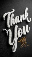Thank you message in decorative white font on dark textured wall showcasing gratitude and appreciation photo