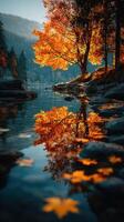 Autumn landscape with vibrant orange trees reflecting on calm water in serene setting photo