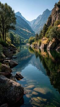 Clear river flows through rocky landscape with mountains in background during sunny day photo