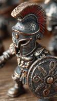 Miniature Roman soldier displayed on a wooden surface showcasing intricate details and craftsmanship in armor and shield photo