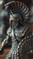 Detailed warrior figurine from ancient history displayed on a wooden surface, showcasing craftsmanship and intricate design photo