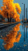 Vibrant autumn foliage reflecting on still water near railway tracks in a peaceful setting photo