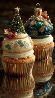 Festive holiday cupcakes decorated with intricate designs and vibrant colors on a reflective surface photo