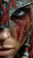 Warrior face paint showcases fierce determination during an intense battle preparation at dusk photo