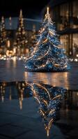 Beautifully illuminated Christmas tree reflecting in puddle at a festive outdoor location in evening twilight photo