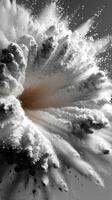 Explosion of fine particles creating a dramatic visual effect in black and white photo