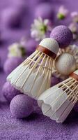 Shuttlecocks arranged with decorative purple balls create an artistic display in a vibrant setting photo