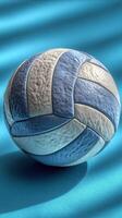 Colorful volleyball resting on a vibrant background with soft shadows in a bright indoor setting during afternoon light photo