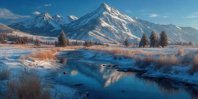 Majestic snow-capped mountains reflecting in a tranquil river under a bright winter sky during early morning hours photo