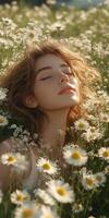 Young woman enjoying a peaceful moment among blooming daisies in a sunlit field during late spring photo