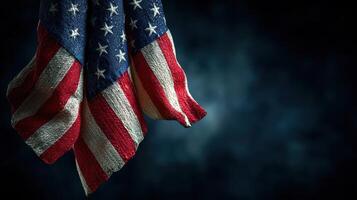 Waving American flag draped elegantly against a dark backdrop highlighting patriotism and national pride photo